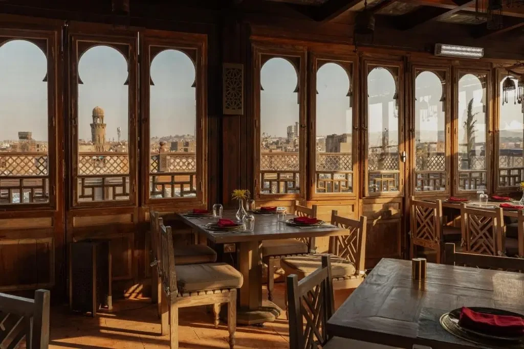 Dinner on the rooftop terrace of boutique hotel Le Riad above the old city of Cairo